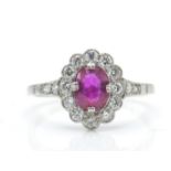 An 18ct white gold ruby and diamond ring