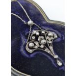 An Art Nouveau diamond pendant necklace. The neckl