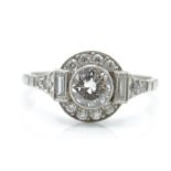 An Art Deco platinum and diamond ring. The ring se