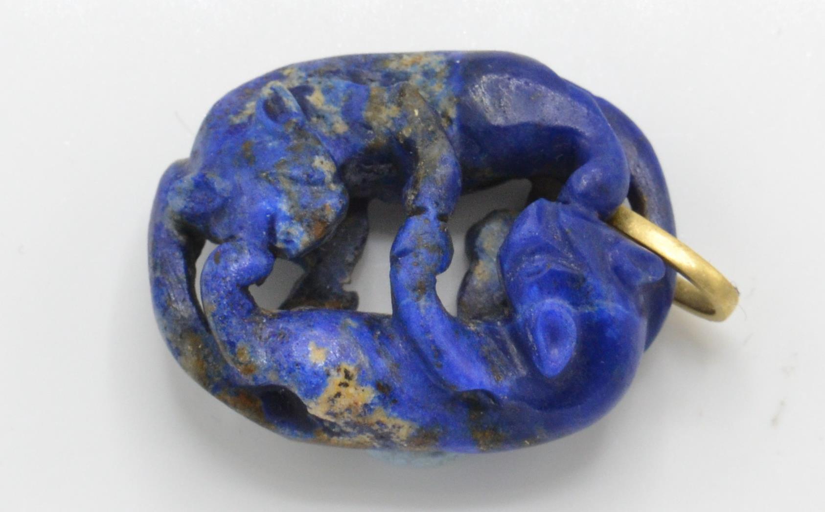 A gold and Lapis Lazuli figural pendant. The penda - Image 2 of 3