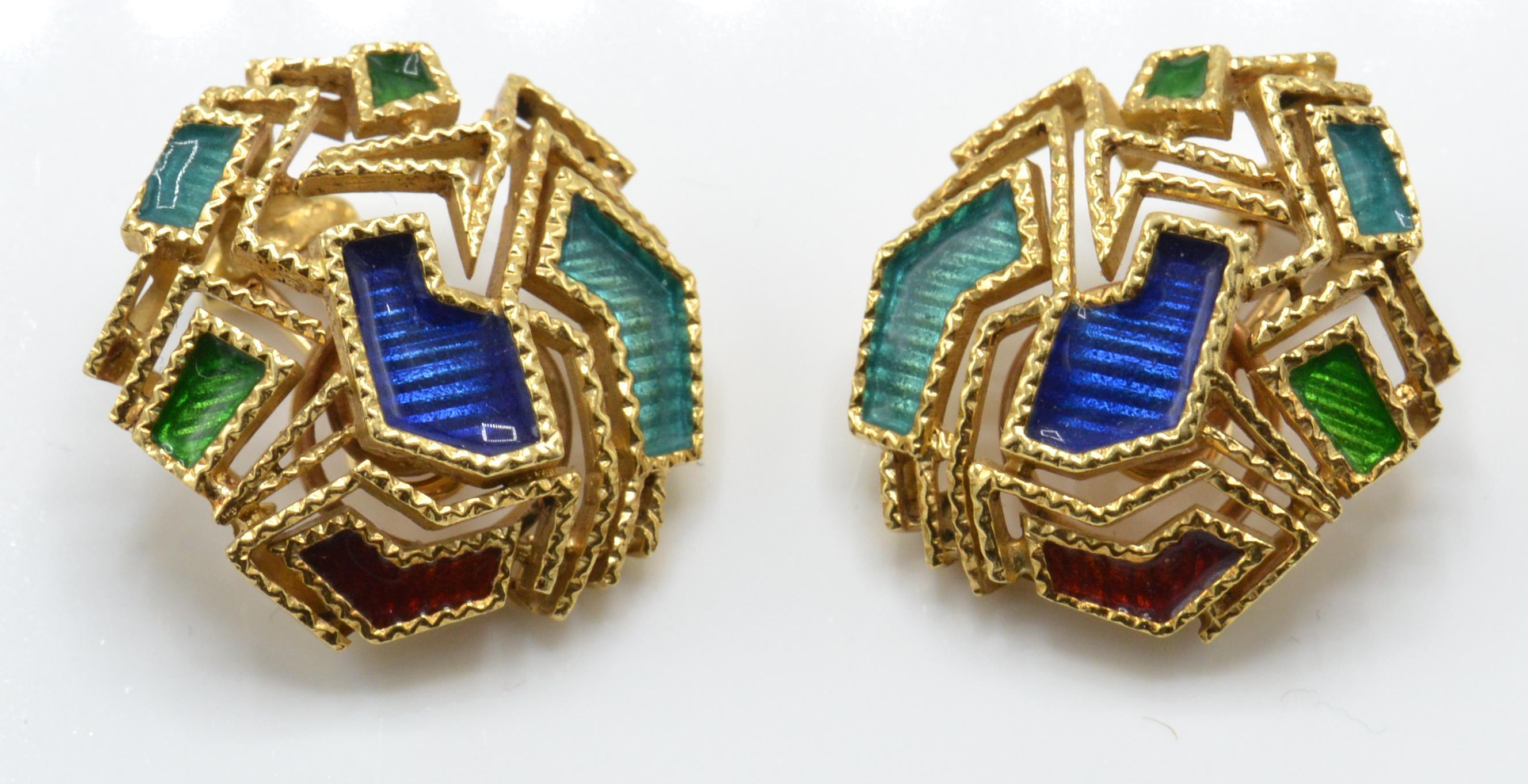 A pair of 18ct gold and enamel ear clips. The earr