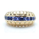 14ct gold and sapphire dome ring. The ring set wit