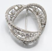 An 18ct white gold and diamond brooch pin. The bro