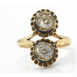 An 18ct gold enamel and diamond ring.Estimated dia
