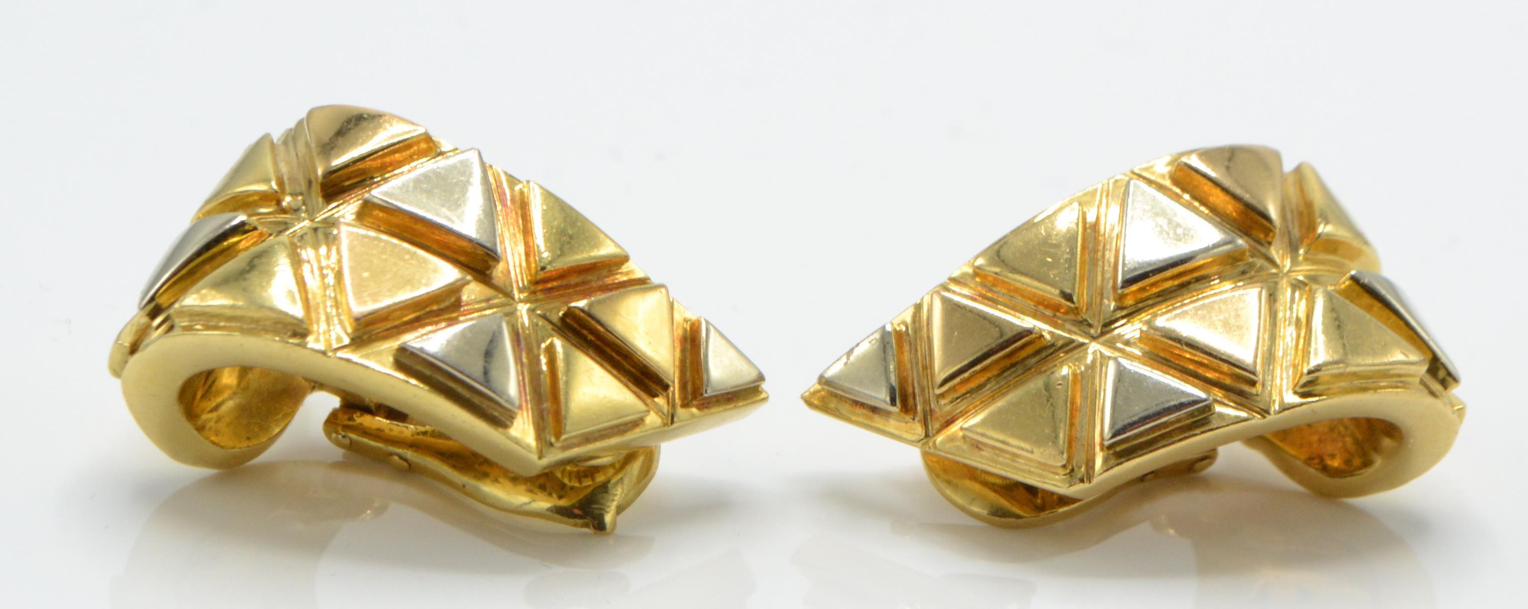 A pair of 18ct gold French signed ear clips. The e