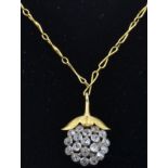 An 18ct gold and diamond pendant necklace. The nec