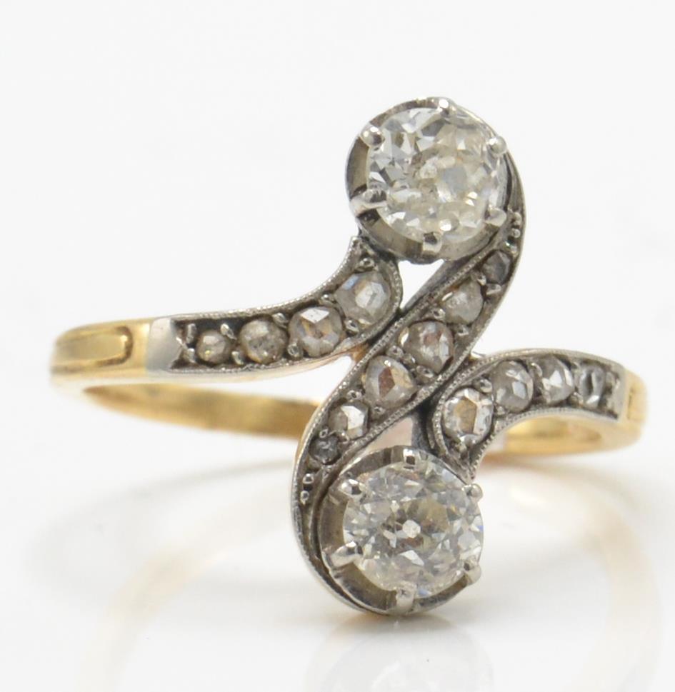 An early 20th century diamond crossover ring. The