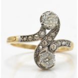 An early 20th century diamond crossover ring. The
