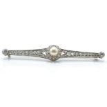 A 14ct white gold pearl and diamond bar brooch pin