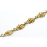 A French gold Art Nouveau seven link bracelet. The