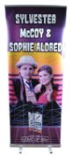 MONOPOLY EVENTS - AUTOGRAPHED BANNER - SYLVESTER MCCOY, SOPHIE ALDRED