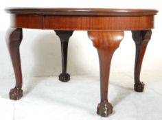 A good 19th Century Victorian flamed mahogany oval extending dining table raised on cabriole legs