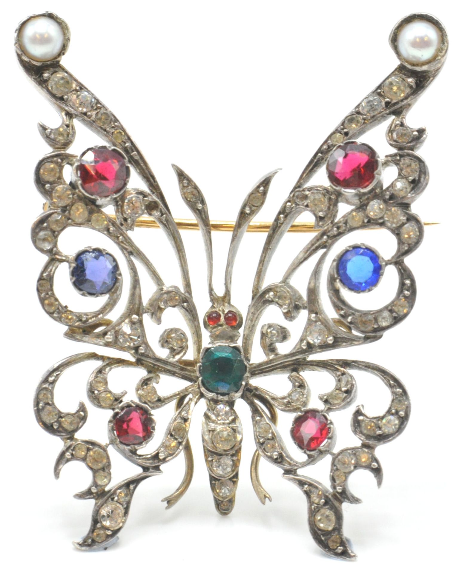 A believed 19th century silver, half pearl and paste set butterfly brooch. The butterfly set with