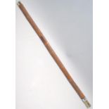 A heavily carved sword stick / walking stick decorated with a carved monkey with floral and