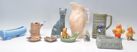 A mixed group of ceramics dating from the early 20th Century to include an Art Deco Clarice Cliff