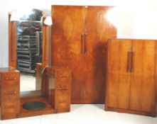 A fantastic Art Deco 1930's walnut bedroom suite including a twin pedestal dressing table with a