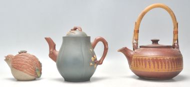 A collection of 3 Chinese Yixing teapots to include a blue ground example with floral decoration,