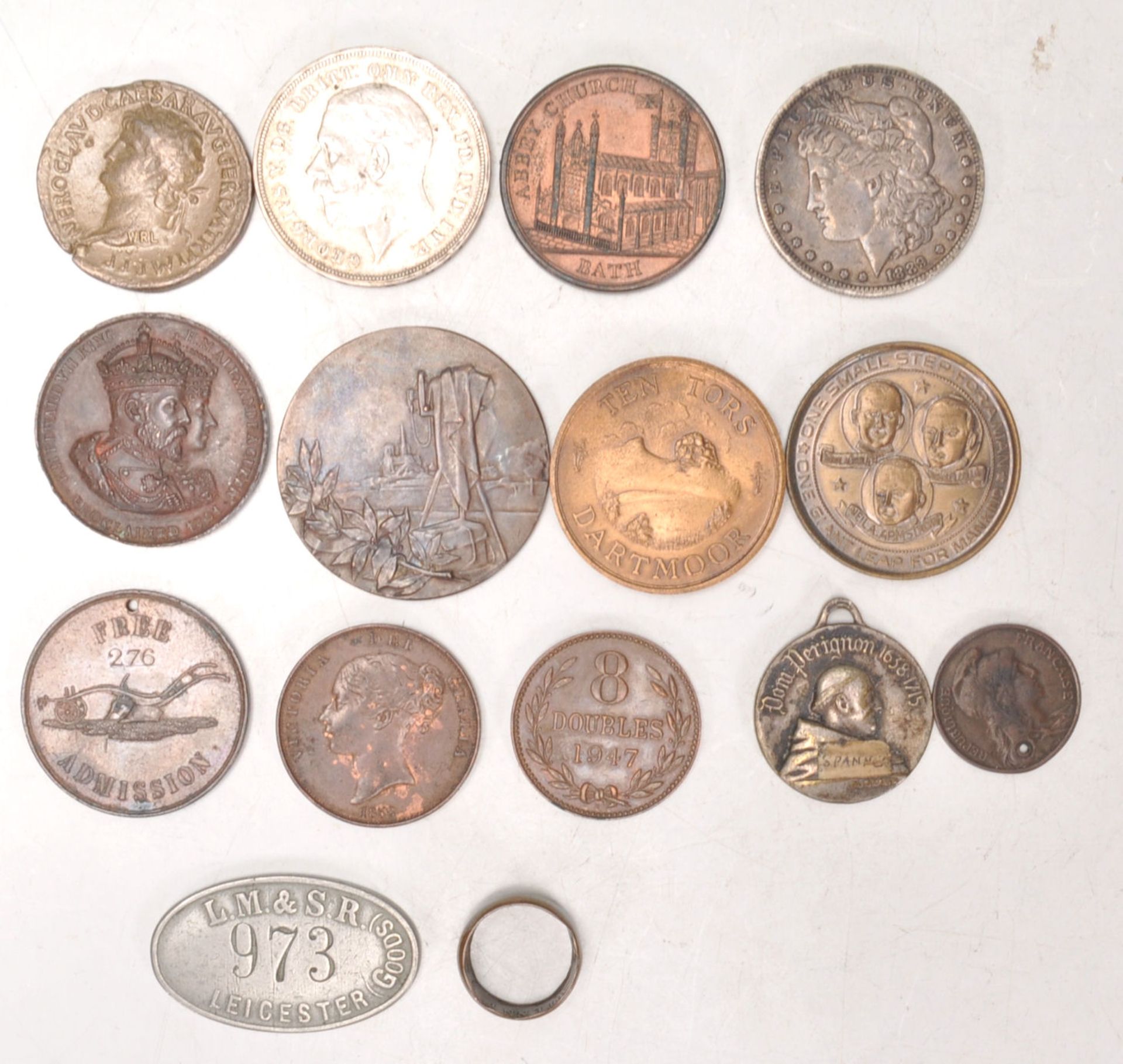 An interesting collection of 19th and 20th Century tokens and medallions to include a Moet Chandon