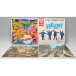A group of four vinyl long LP record albums by the Beatles to include – Sgt Pepper's Lonely Hearts