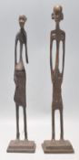 A pair of vintage 20th Century Tribal African bronze fertility figures of slender form. Raised on