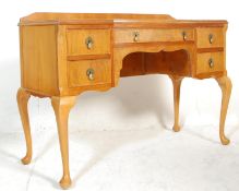 A mid century Queen Anne walnut writing table desk. Raised on cabriole legs with pad feet. Above a