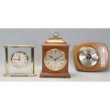 A good quality oak cased mantel clock having a silvard face with Roman numeral chapter ring,