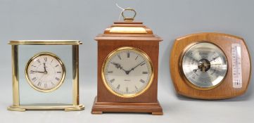 A good quality oak cased mantel clock having a silvard face with Roman numeral chapter ring,