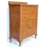 A early 20th Century oak tallboy chest of drawers - linen cupboard. The tallboy having two drawers
