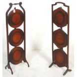 Two early 20th Century 1930's oak metamorphic folding cake stands each having three tiers of round