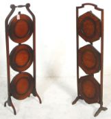 Two early 20th Century 1930's oak metamorphic folding cake stands each having three tiers of round