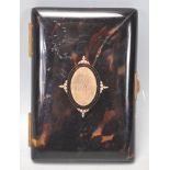 A 19th Century Victorian tortoise shell cheroot / cigarette case having a gilt panel to the front