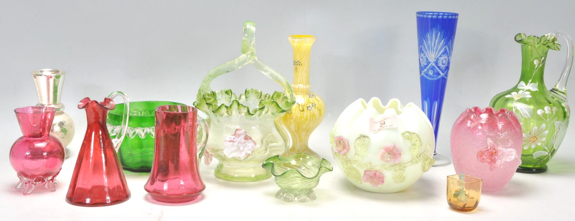 A group of 19th Century Victorian coloured glass vases to include a yellow and white vase with