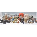 A large collection of vintage / retro 20th century elephant figurines to include largely wooden
