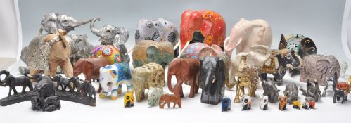 A large collection of vintage / retro 20th century elephant figurines to include largely wooden