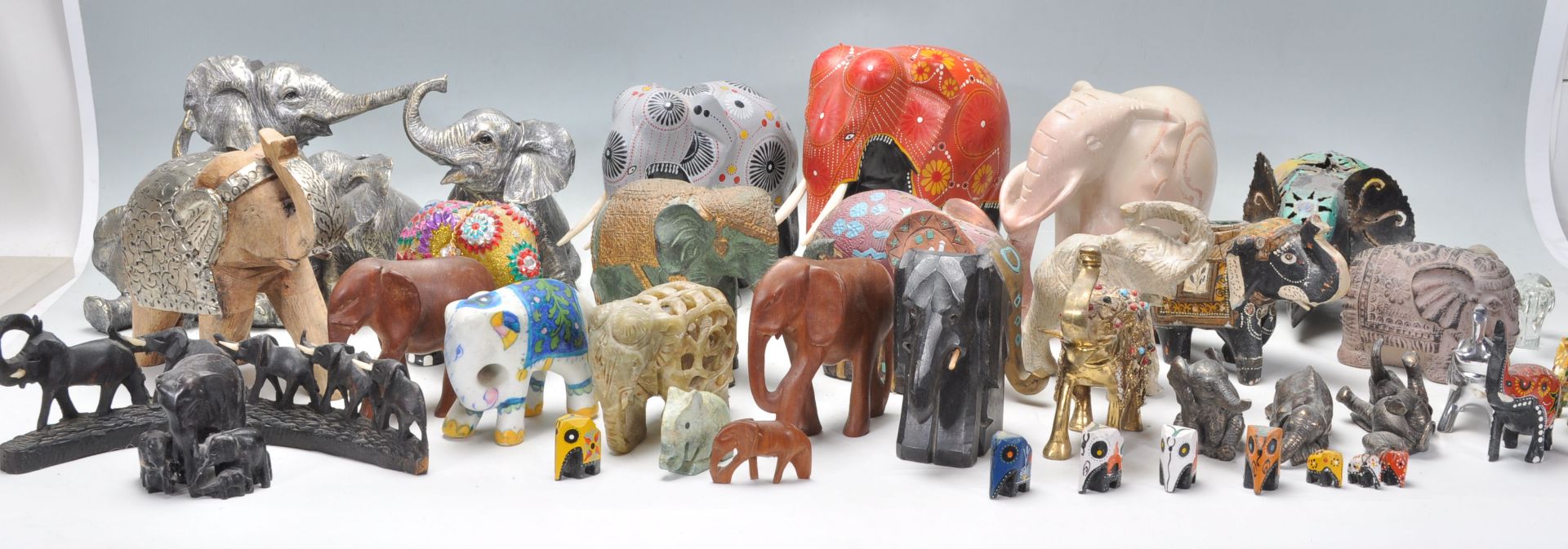 A large collection of vintage / retro 20th century elephant figurines to include largely wooden