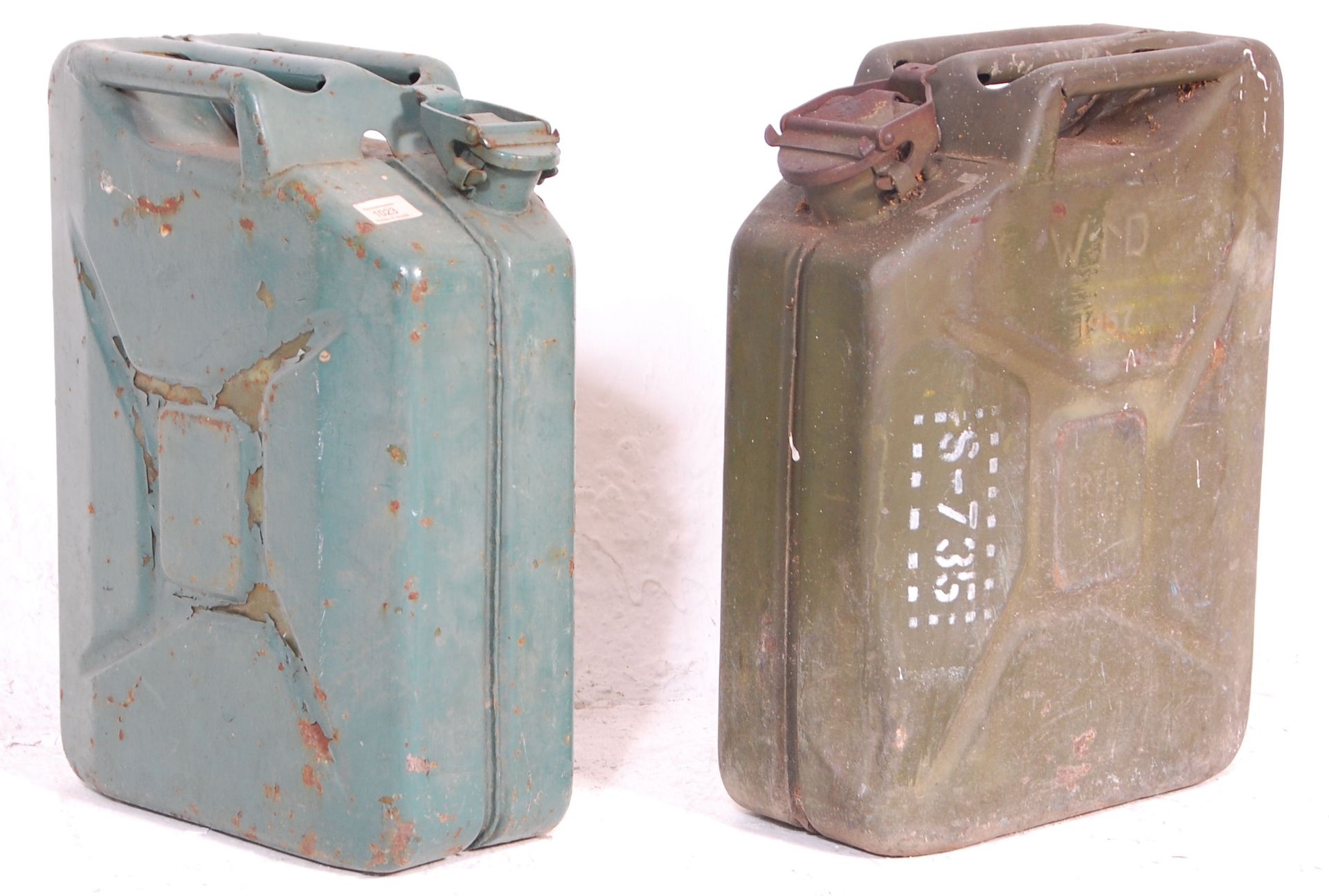 Two vintage 20th Century military jerry petrol cans, both retaining original green paintwork with