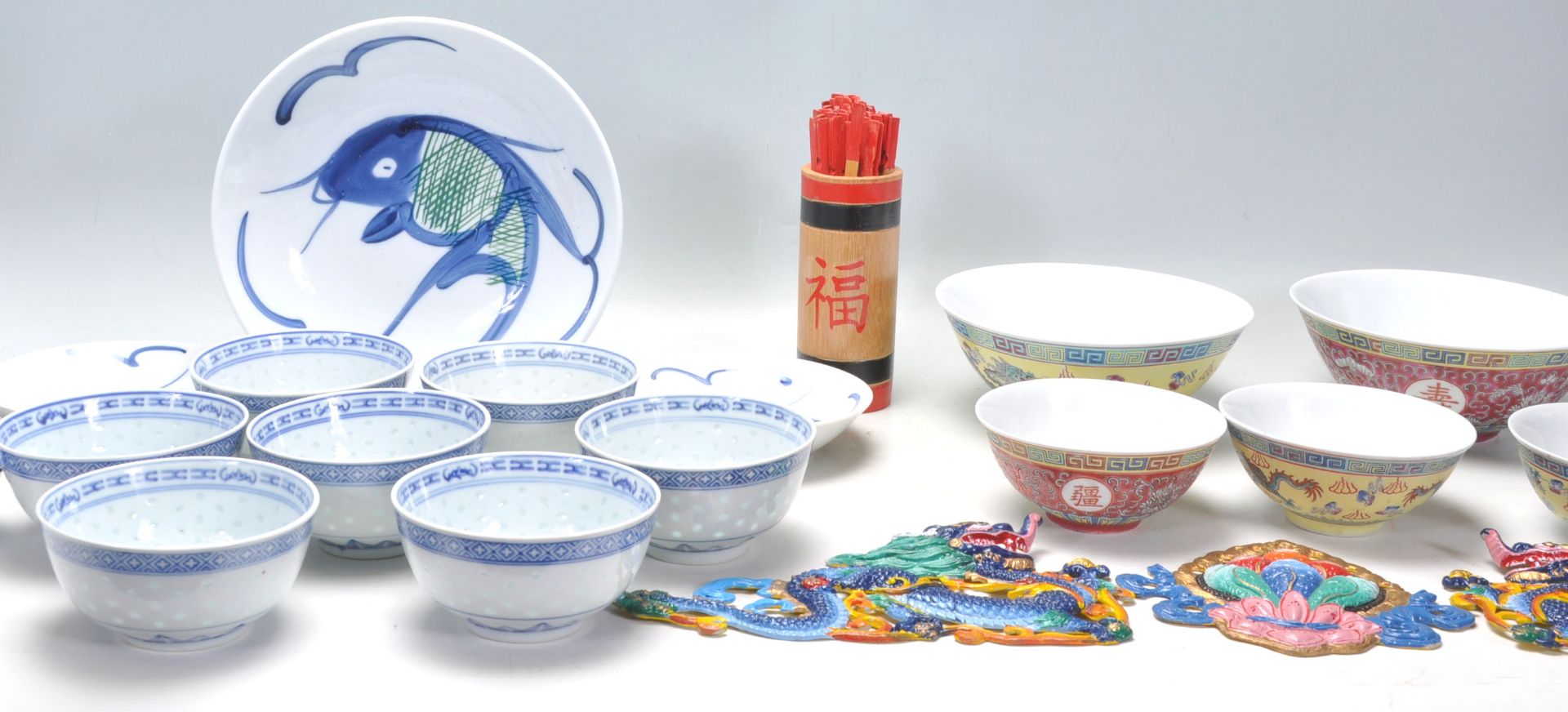 A collection of 20th Century Chinese / Japanese blue and white rice bowls with floral and plantain