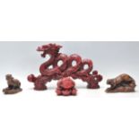 A collection of 20th Century Chinese figurines to include a faux cinnabar dragon clutching the