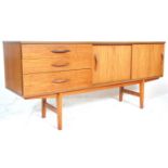 Avalon Furniture - A mid century teak wood sideboard credenza being raised on tapering legs with a