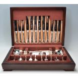 A mahogany cased silver plate six person canteen of cutlery by Sheffield Cutlery with the knife's