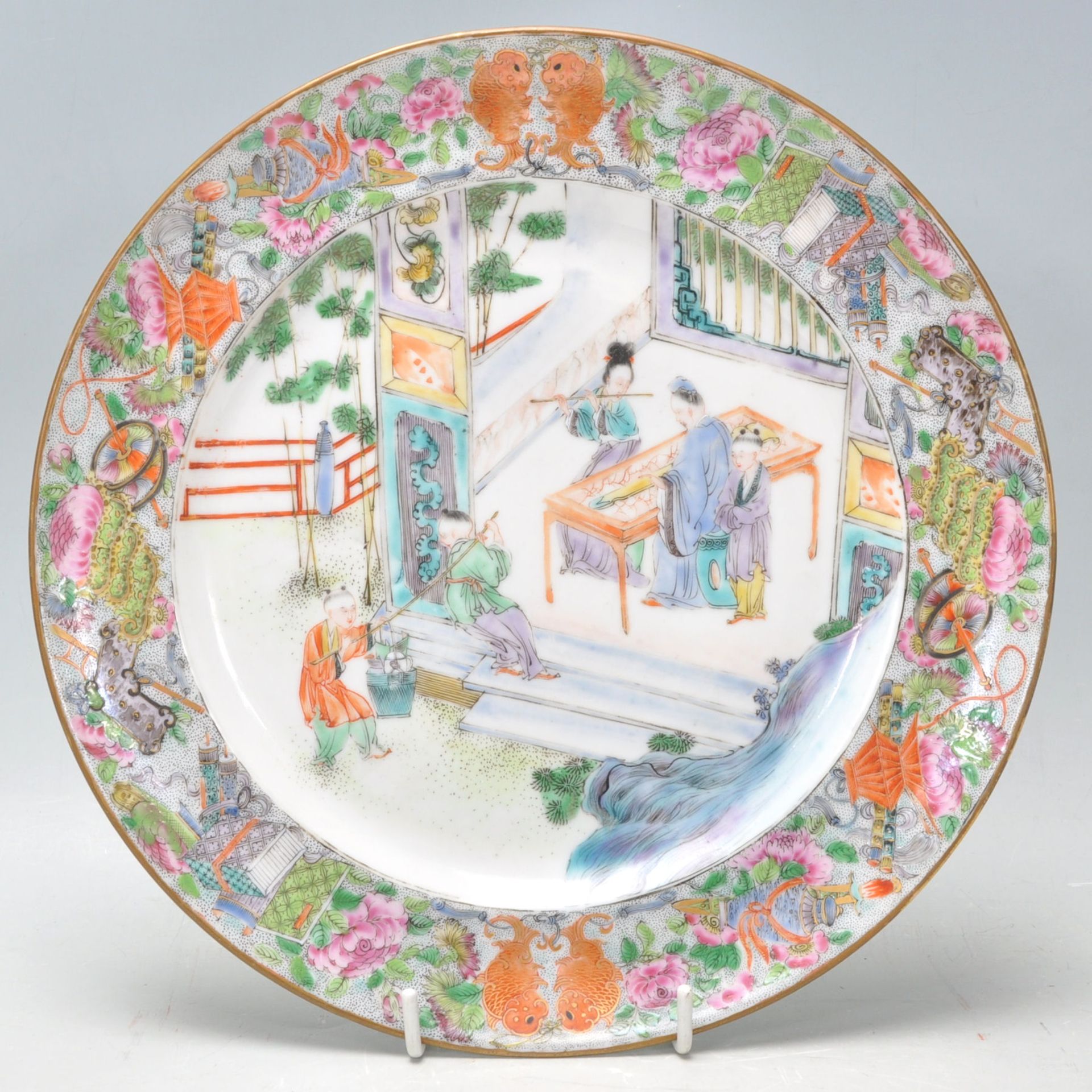 An 18th century Chinese antique porcelain plate depicting a scene of an elder inspecting a sword