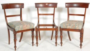 A group of three early 19th century Regency mahogany bar back dining chairs having knopped and