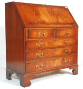A good quality 19th century revival flame mahogany bureau desk being raised on bracket feet with