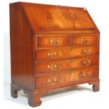 A good quality 19th century revival flame mahogany bureau desk being raised on bracket feet with