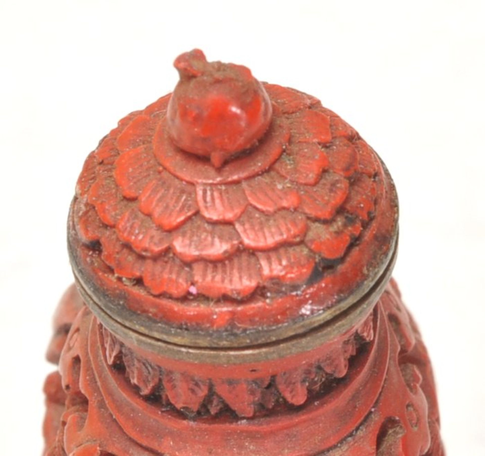An Antique Chinese red cinnabar snuff bottle carved with landscape scenes and carved stopper atop. - Image 5 of 6