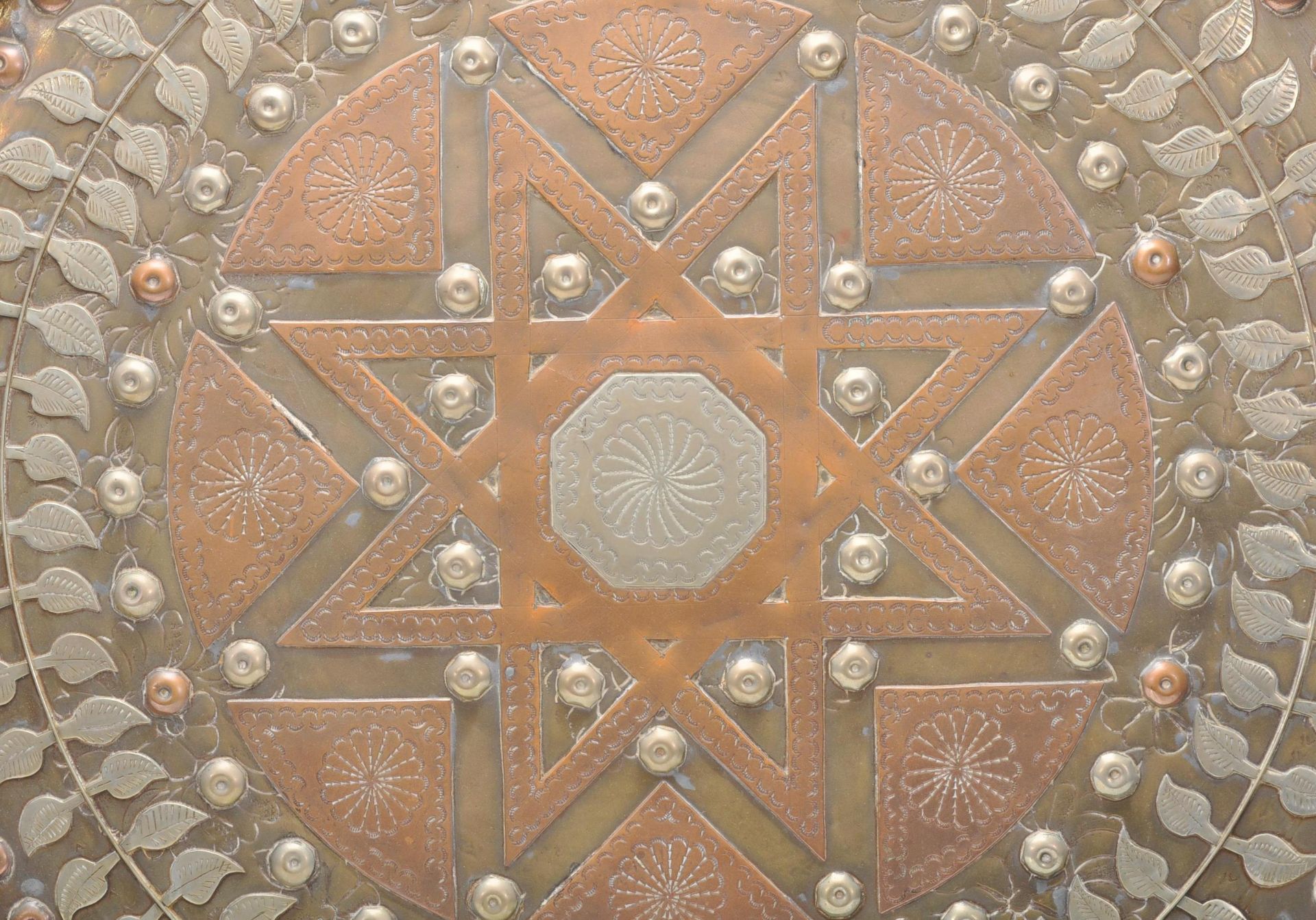 A 20th Century Middle Eastern brass and copper wall charger of circular form having inlaid white - Bild 3 aus 8