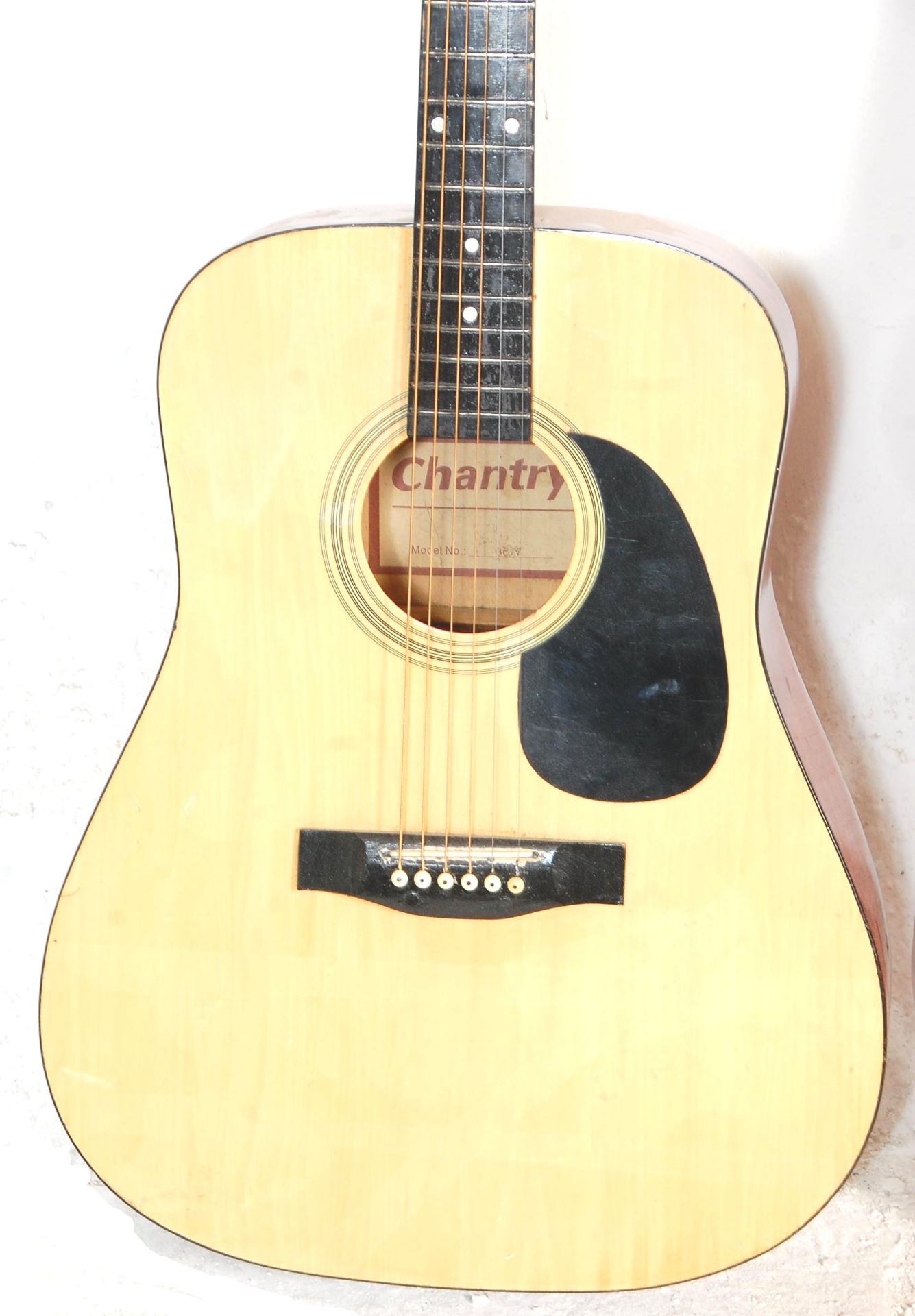 A good Chantry made acoustic guitar having a black