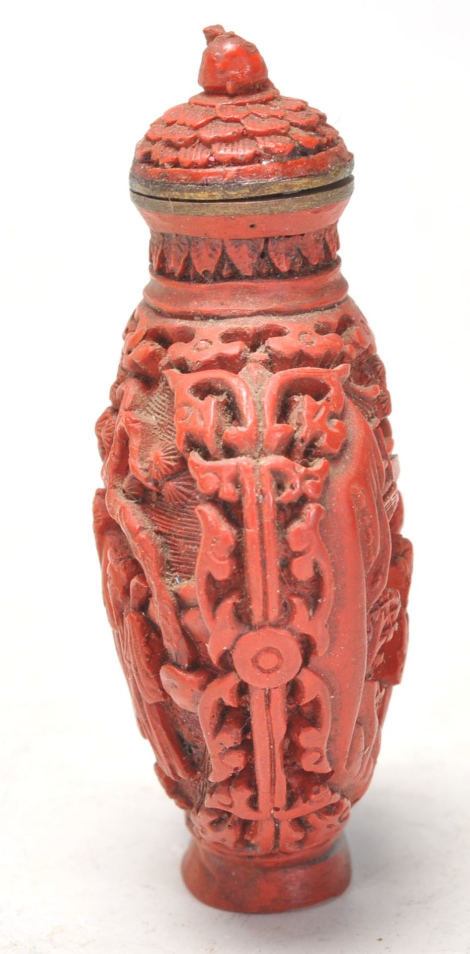 An Antique Chinese red cinnabar snuff bottle carved with landscape scenes and carved stopper atop. - Image 4 of 6