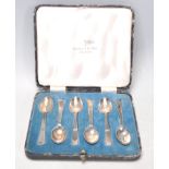 A set of six 1930's Art Deco Walker and Hall silver hallmarked tea spoons having stepped design
