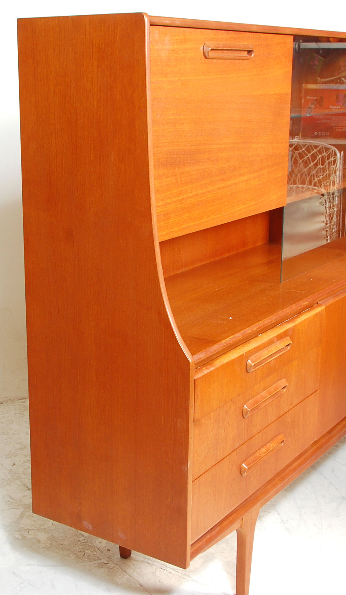 A retro mid 20th Century teak wood sideboard / highboard having a drop down cocktail cabinet to - Image 7 of 10